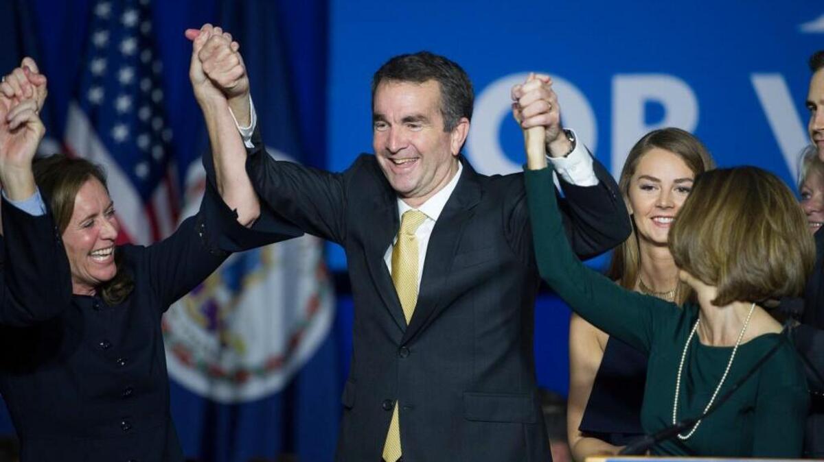 Virginia Gov.-elect Ralph Northam celebrates his election victory with his wife Pam and daughter Aubrey, right, and Dorothy McAuliffe, wife of Virginia Gov. Terry McAuliffe at the Northam For Governor election night party at George Mason University in Fairfax, Va., Tuesday, Nov. 7, 2017.