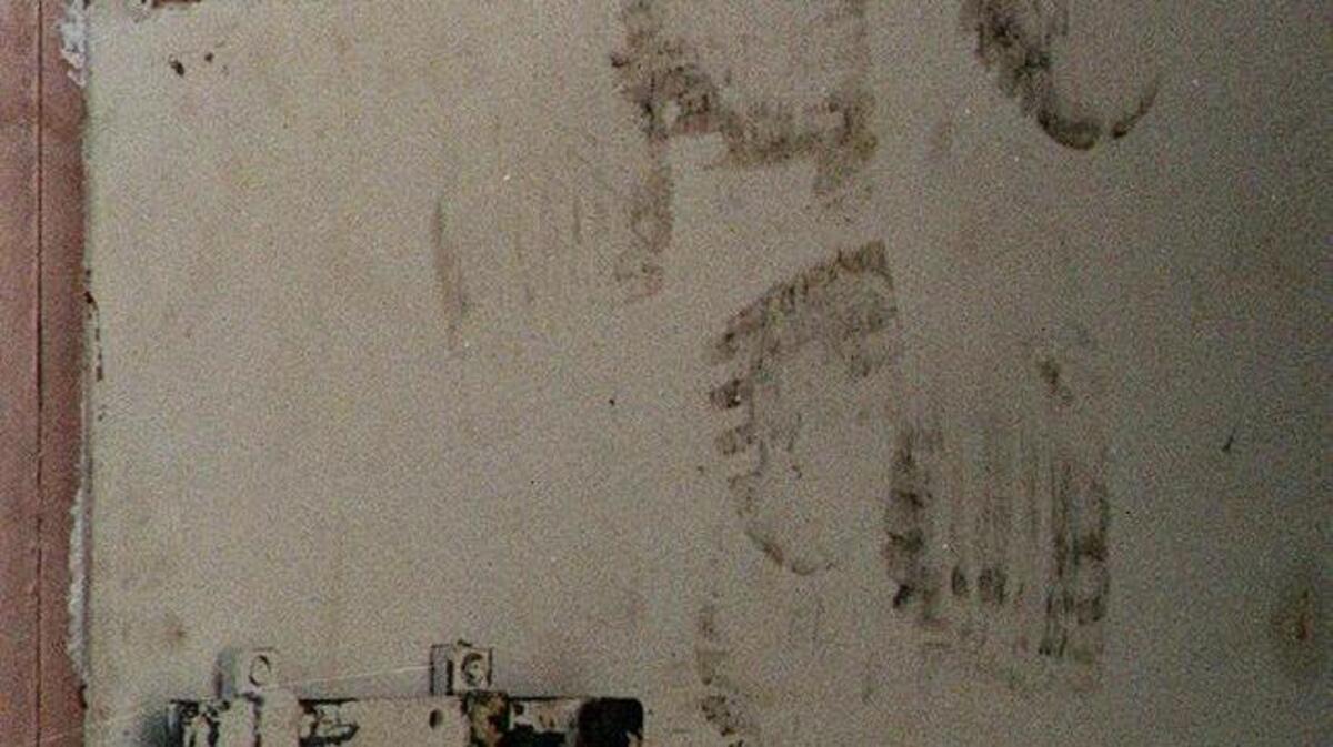 Blackened footprints mark the door to the employee lounge where workers tried to kick their way out to escape the fire at Imperial Food Products plant in Hamlet. Witnesses said the doors at the plant were locked, trapping workers inside.