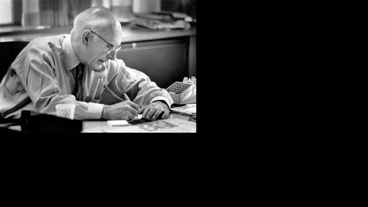 
 Claude Sitton, editor of The News & Observer, works in his office at the newspaper in 1990. 
