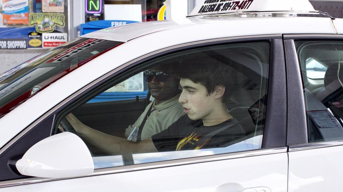 
Asher Philips, 15, runs through a driving checklist alongside of instructor Curtis Wilson during the the behind-the-wheel portion of the driver's education program run by Jordan Driving School Wednesday, August 19, 2015 in Raleigh.
