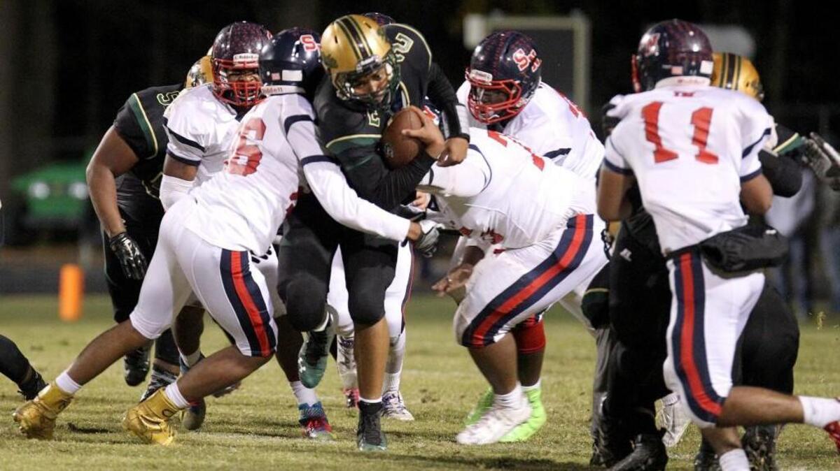 Northern Nash's Davontae Wiggins (2) keeps the ball and runs up the middle during the first half of the Southern Nash High School football game against Northern Nash High School in Rocky Mount on Thursday, Nov. 10, 2016. A survey rates North Carolina as the state with the “most comprehensive” health and safety policies for student athletes.