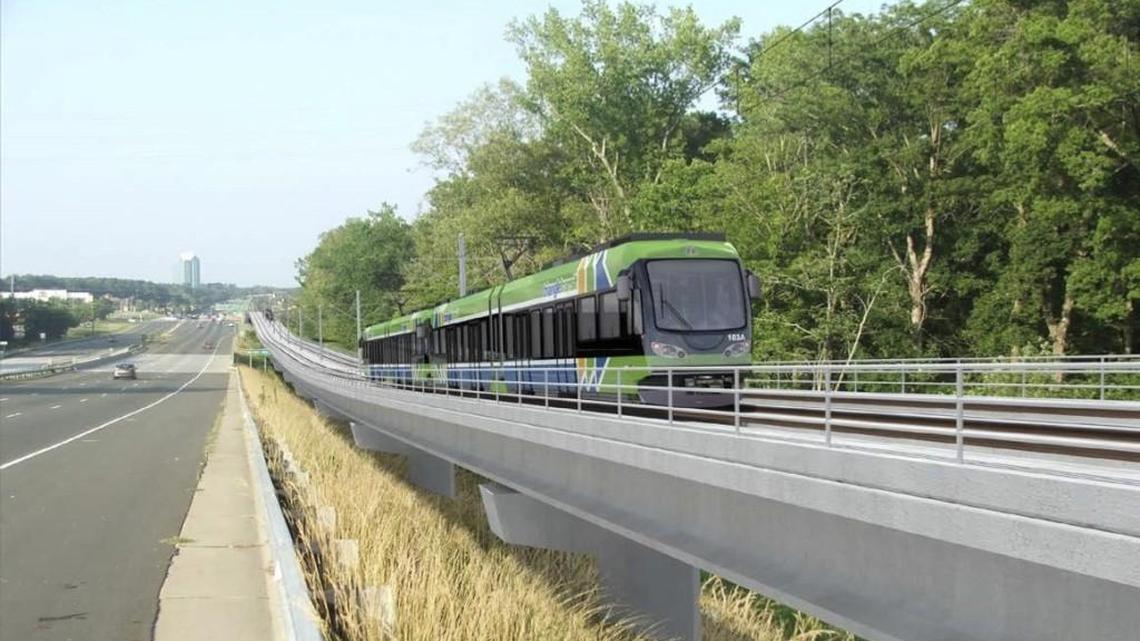 
An artist's rendering depicts a light-rail train running beside U.S. 15-501 over New Hope Creek in Durham.
