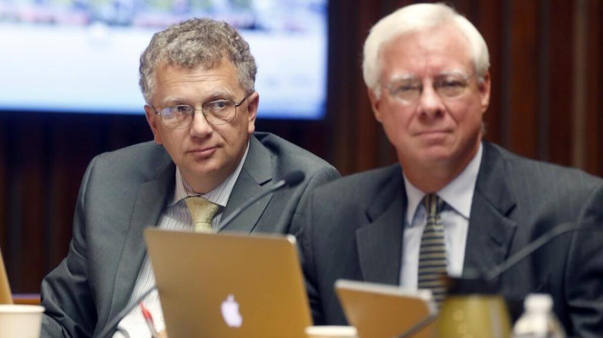 Raleigh City Council members David Cox, left, and Russ Stephenson listen during the Raleigh City Council regular session in the Council Chamber in the municipal building in Raleigh on Tuesday, June 21, 2016.