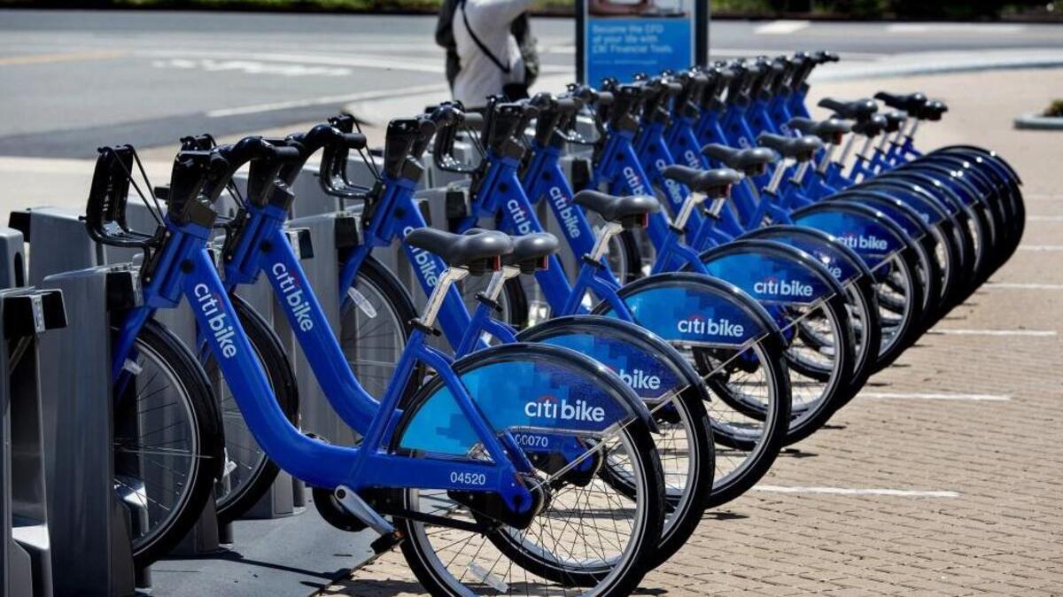 Bicycles that are part of the NYC Bike Share program are lined up at a dock and lock station at the Brooklyn Navy Yards in New York.