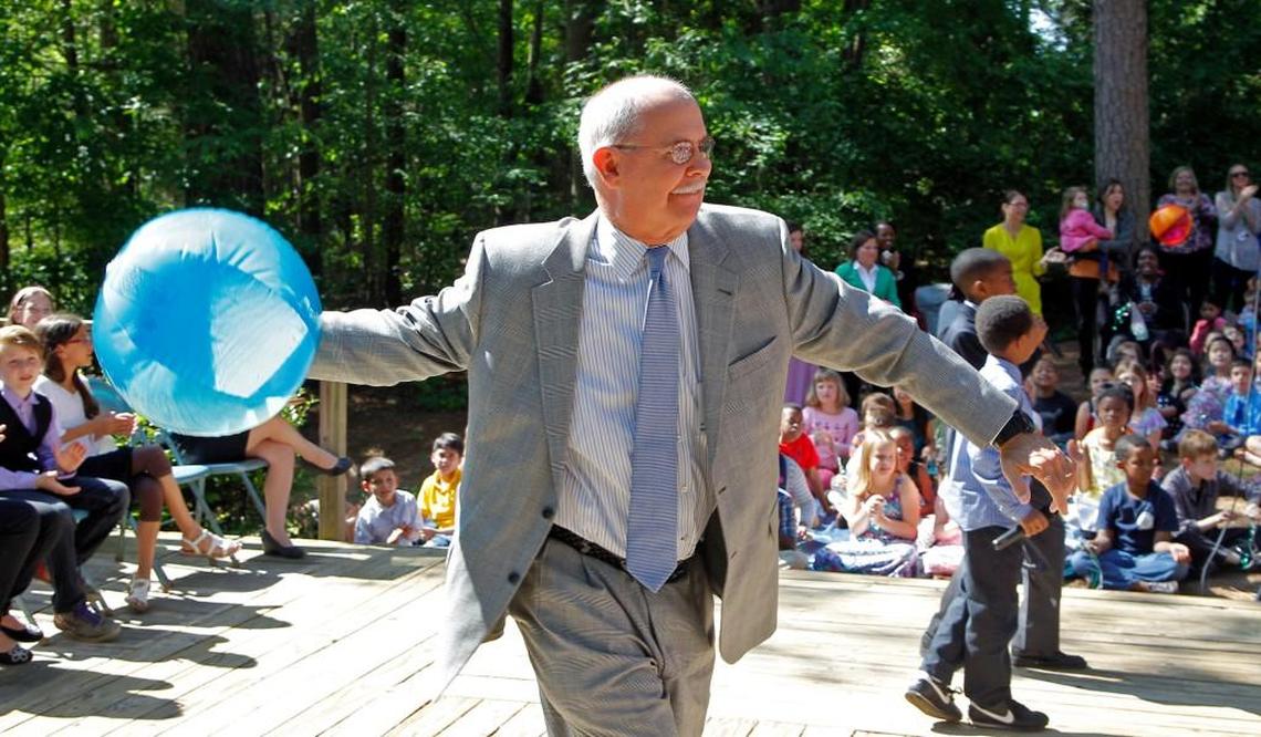 Dr. Jim Merrill, Wake County Superintendent of Schools, throws a beach ball into the crowd to get things rocking at a celebration held at Combs Elementary School after it was named the best magnet school in the country on May 19, 2014.