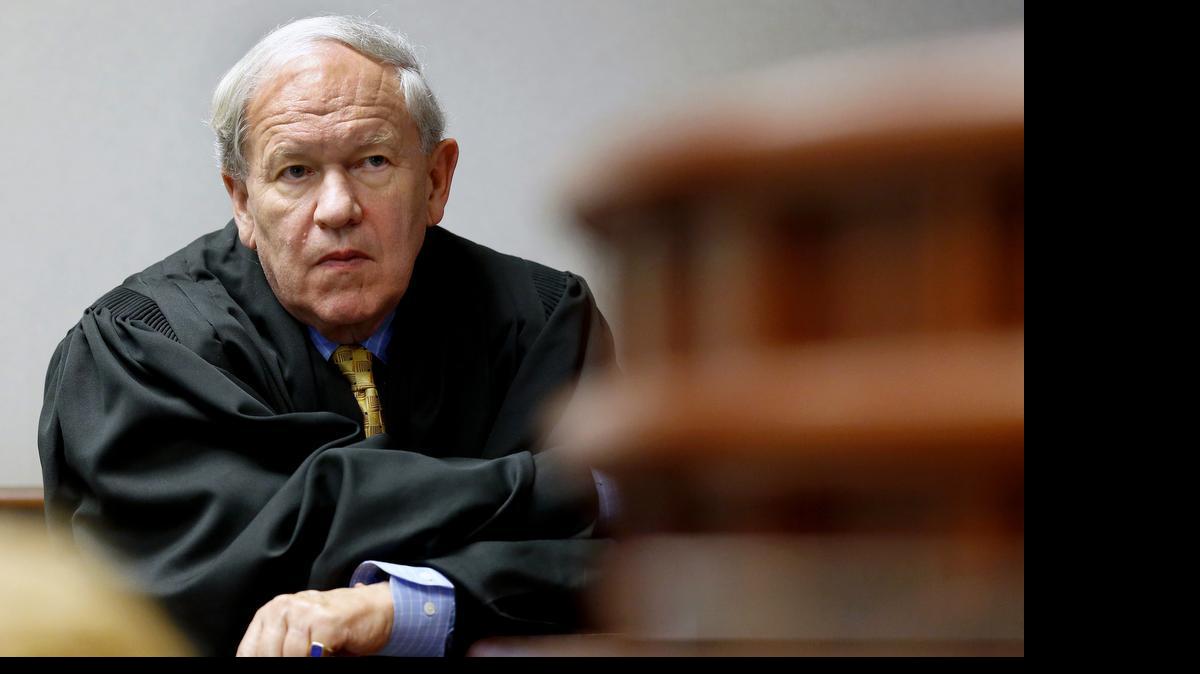 
Superior Court Judge Howard Manning steps down from his seat and listens as a witness testifies as he presides over a Leandro education hearing in a Wake County courtroom on July 23, 2015. Manning retires at the end of the month, but said he'll keep control of Leandro in retirement. 
