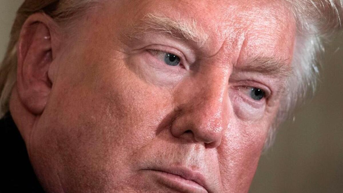 President Donald Trump listens during a press conference Thursday at the White House. He insisted there was no collusion between his presidential campaign and Russian officials and called the appointment of a special counsel to investigate possible ties with Russia “a witch hunt.”