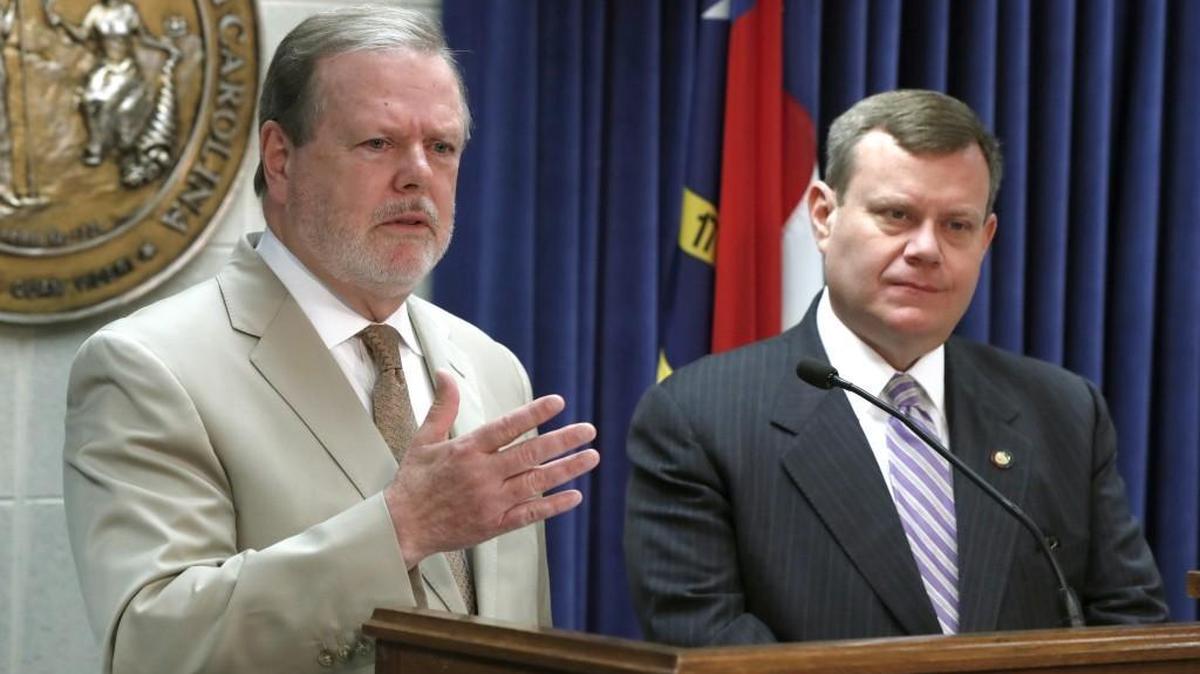 N.C. Senate President Pro Tem Phil Berger, left, and N.C. House Speaker Tim Moore talk during a news conference at the Legislative Building in Raleigh, N.C., Thursday, May 17, 2018.