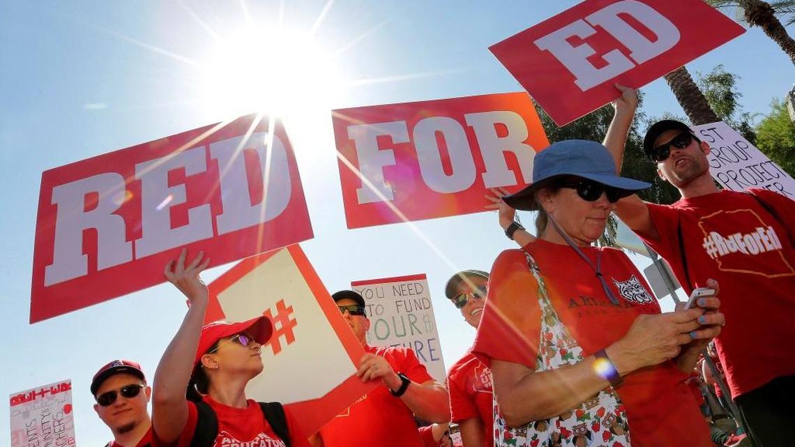 Teachers rally outside the Capitol on April 27, 2018 in Phoenix on their second day of walkouts. Teachers in Arizona and Colorado walked out of their classes over low salaries keeping hundreds of thousands of students out of school. It's the latest in a series of strikes across the nation over low teacher pay.