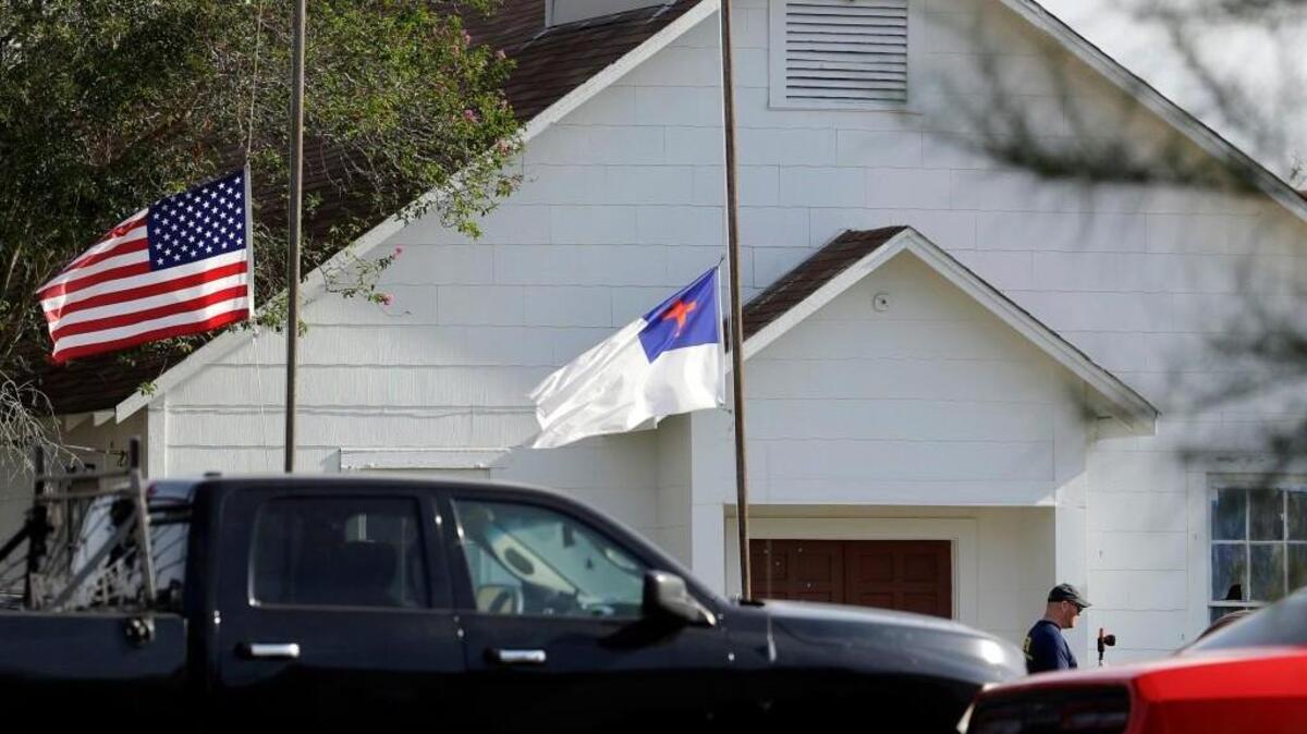 In this Nov. 7, 2017, file photo, flags fly at half-staff as law enforcement officials continue to investigate the scene of a shooting at the First Baptist Church of Sutherland Springs in Sutherland Springs, Texas.