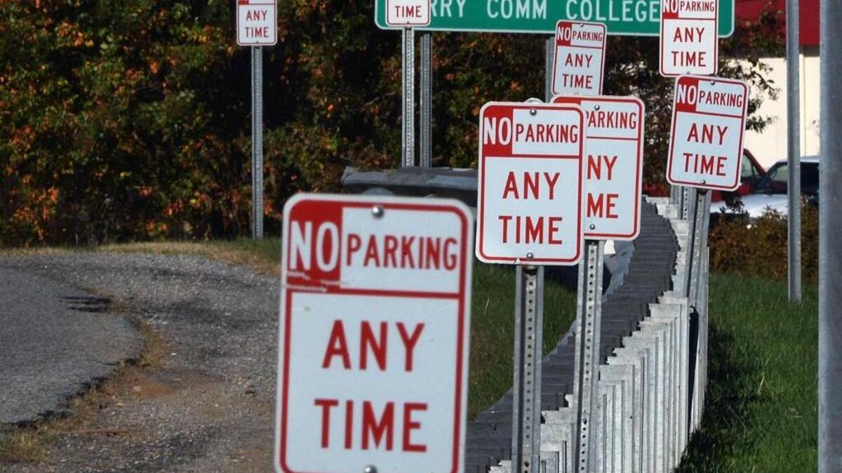 The exit ramp on I-77 Exit 93, Zephyr Road in Dobson is loaded with signs warning of a “No Parking” area along the ramp. Surry County is where NC Highway Patrol troopers write the most tickets for roadside napping to interstate truckers.