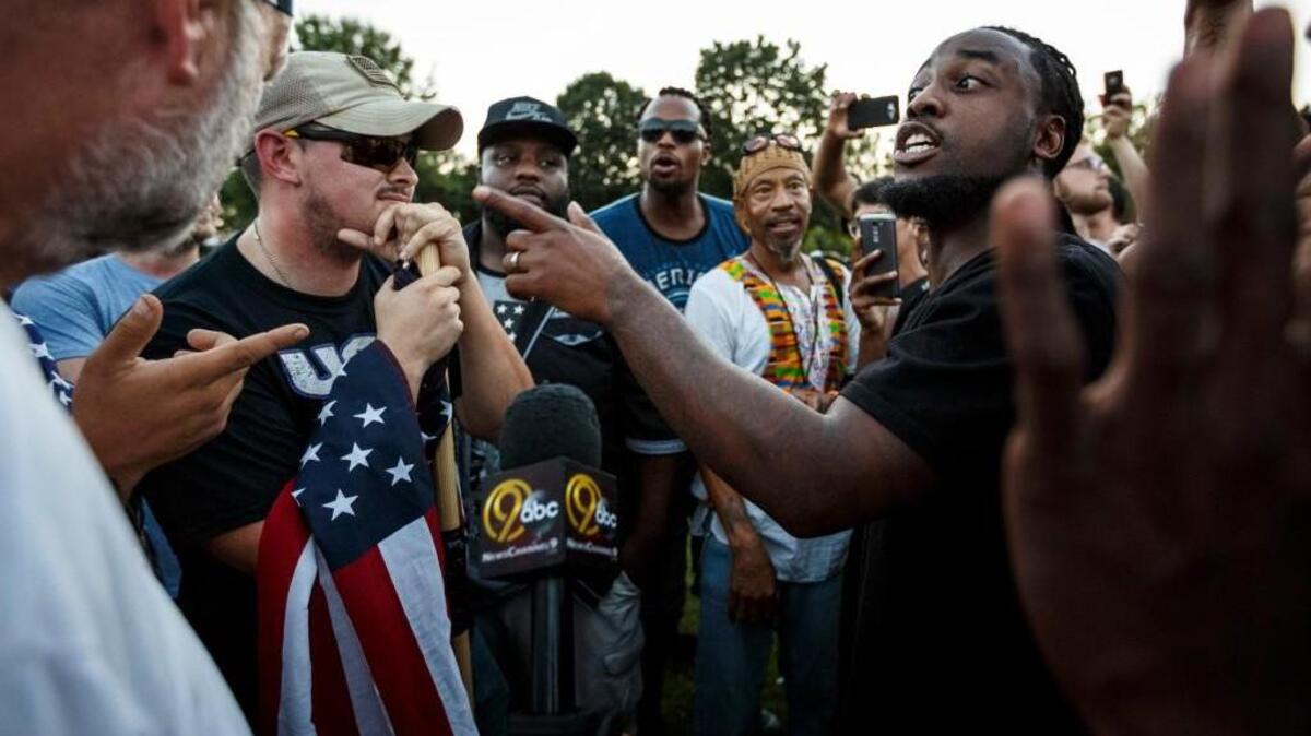 A man argues with counter demonstrators about race relations during a rally in Coolidge Park on Thursday, Aug. 17, 2017, in Chattanooga, Tenn. Organizers said that the purpose of the demonstration, held in response to Saturday's rally by white nationalists in Charlottesville, Va., was to declare resistance against Nazism.
