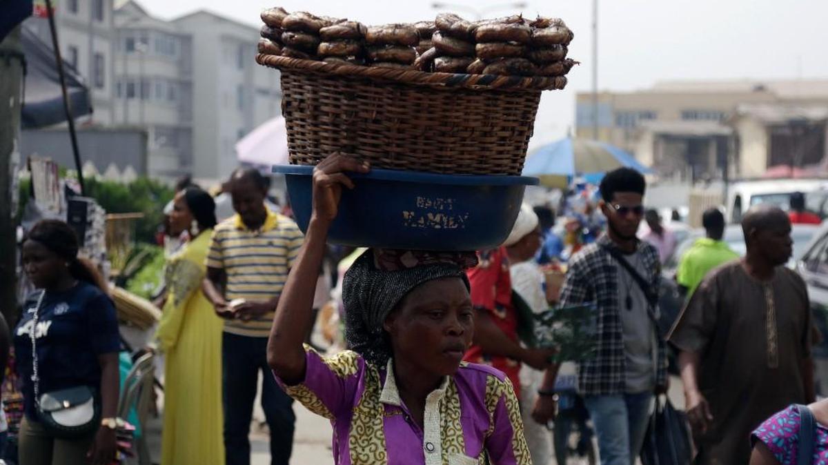 A woman sells fish on a street in Lagos, Nigeria, Friday, Jan. 12, 2018. Africans were shocked on Friday to find President Donald Trump had finally taken an interest in their continent. But it wasn't what people had hoped for. Using vulgar language, Trump on Thursday questioned why the U.S. would accept more immigrants from Haiti and "s---hole countries" in Africa rather than places like Norway in rejecting a bipartisan immigration deal. On Friday he denied using that language.
