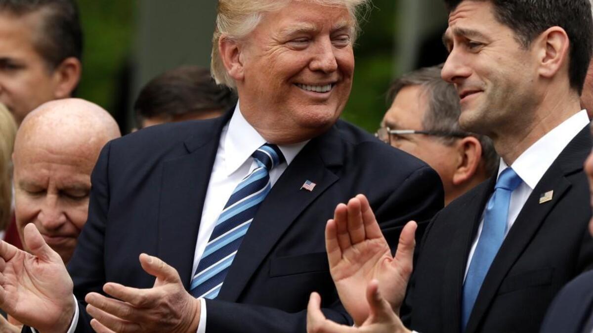 President Donald Trump talks with House Speaker Paul Ryan Thursday in the Rose Garden at the White House after Republicans passed legislation aimed at repealing and replacing the Affordable Care Act.