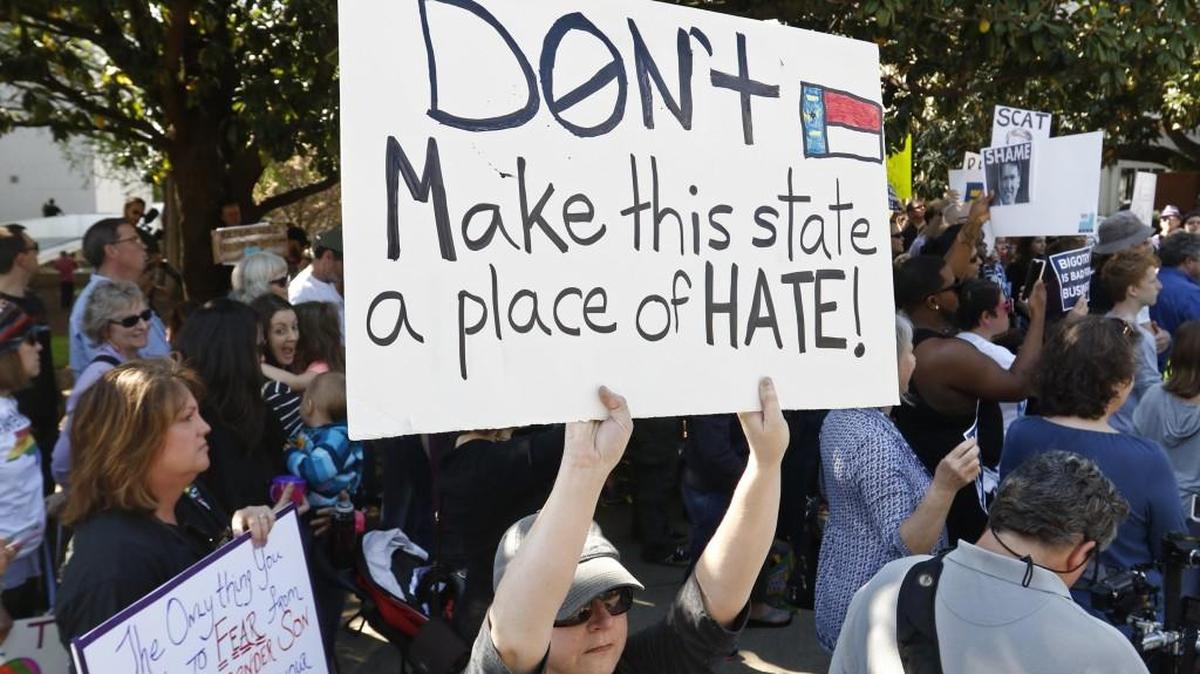 Nicole Root of Cary, NC stood silently with her protest sign facing the Governor’s Mansion during a protest against HB2 in April 2016.