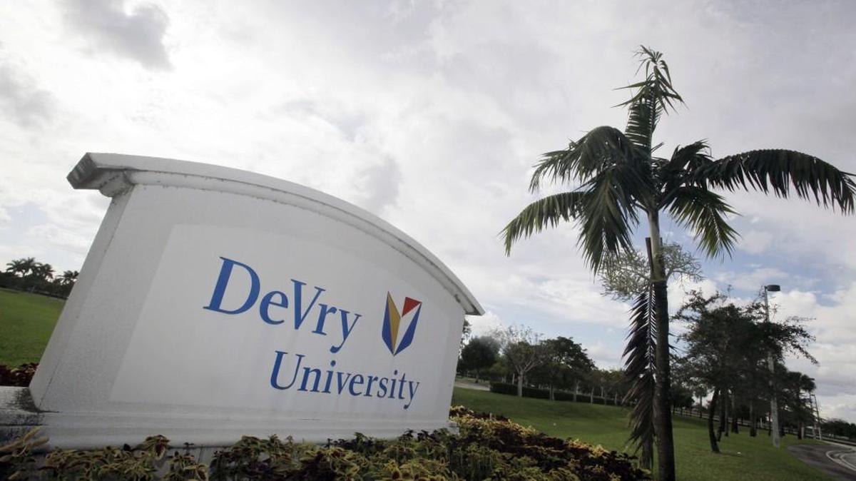 This Nov. 24, 2009, file photo, shows the entrance to the DeVry University in Miramar, Fla. Since Donald Trump's election, shares in the parent company of DeVry University have increased to their highest value in more than a year. The Federal Trade Commission has filed suit against the operators of DeVry, alleging that advertisements for the school deceived consumers about the likelihood that students would find jobs in their fields of study.