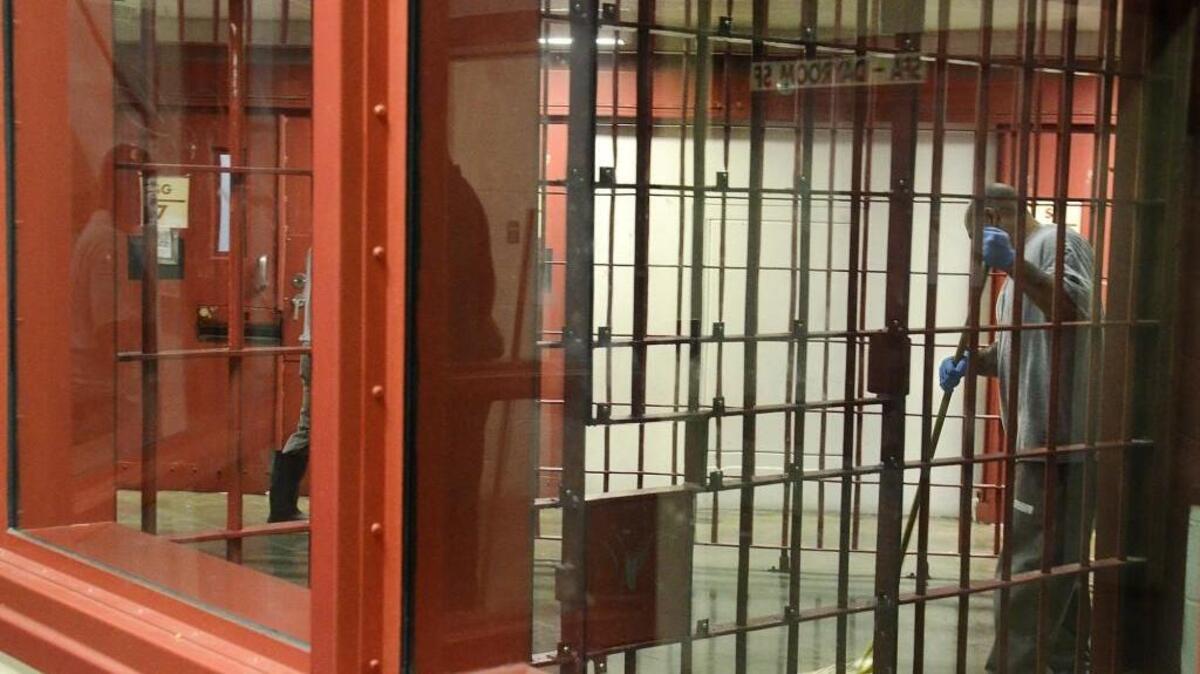 An inmate mops the floor of a restricted housing or segregated unit at Lanesboro Correctional Institution in Polkton.