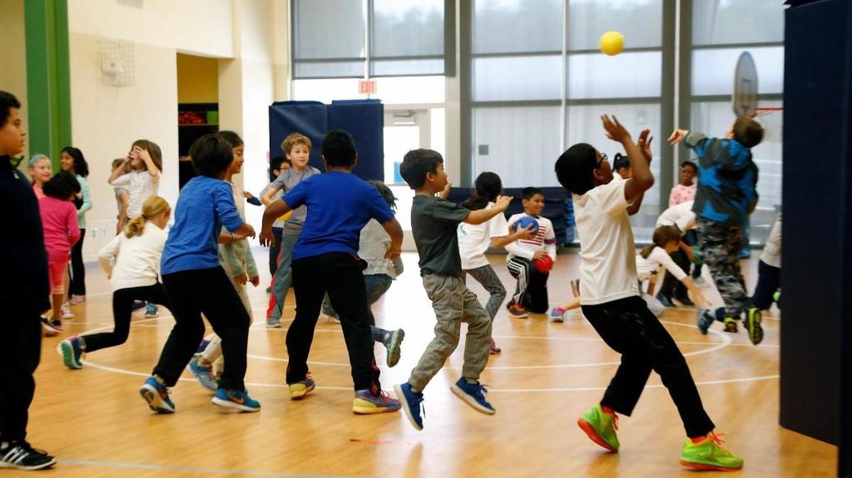 Third graders play "Turkeys in the oven" during gym class at Mills Park Elementary in Cary NC on Nov. 22, 2016.