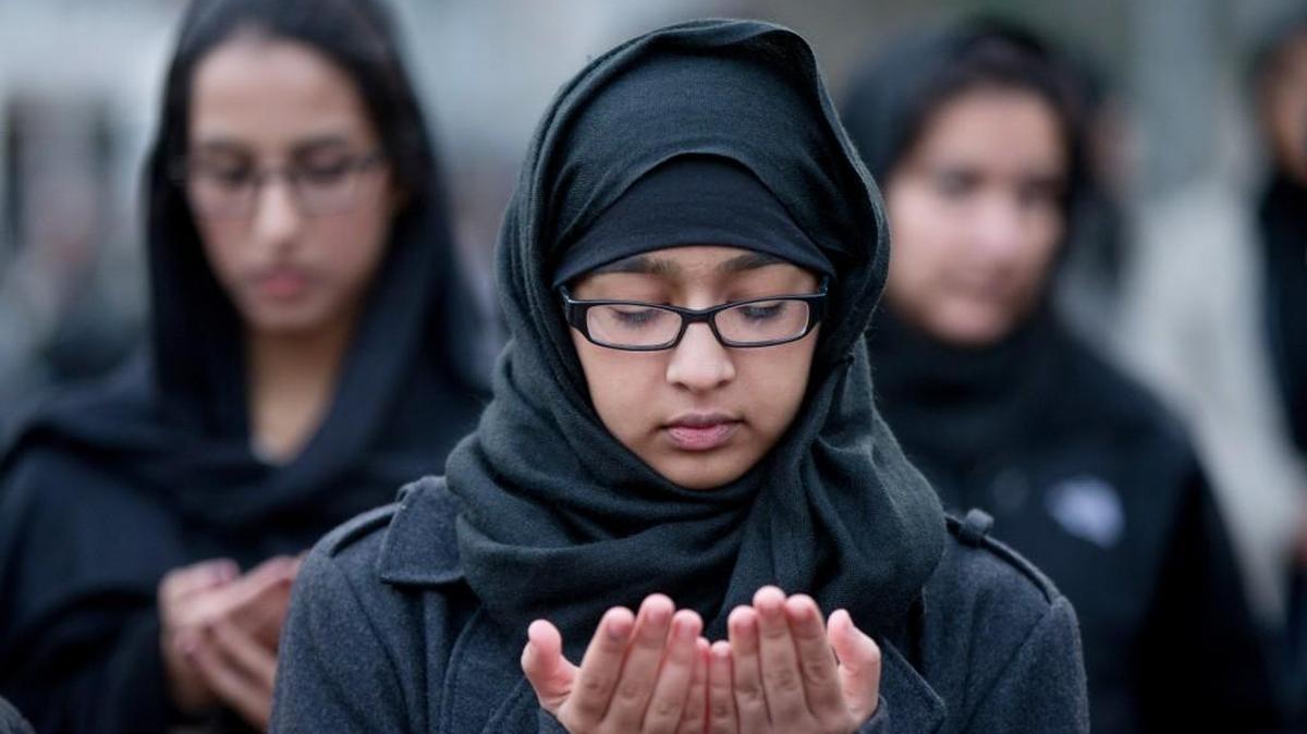 Shiite Muslims pray together while they rally for peace outside the White House in Washington.