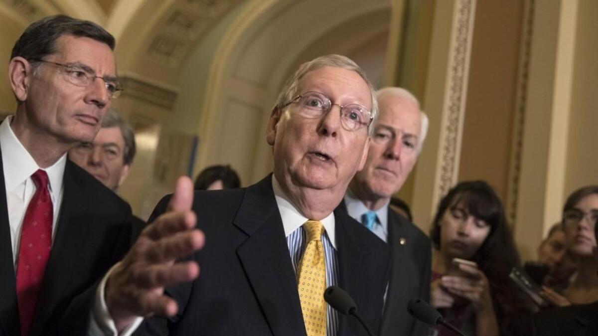 Senate Majority Leader Mitch McConnell, R-Ky., flanked by Sen. John Barrasso, R-Wyo., left, and Majority Whip John Cornyn, R-Texas, speaks at the Capitol in Washington on June 6. Republicans on Capitol Hill push ahead with their legislative and political agenda largely unconcerned with former FBI Director James Comey’s testimony about President Donald Trump.