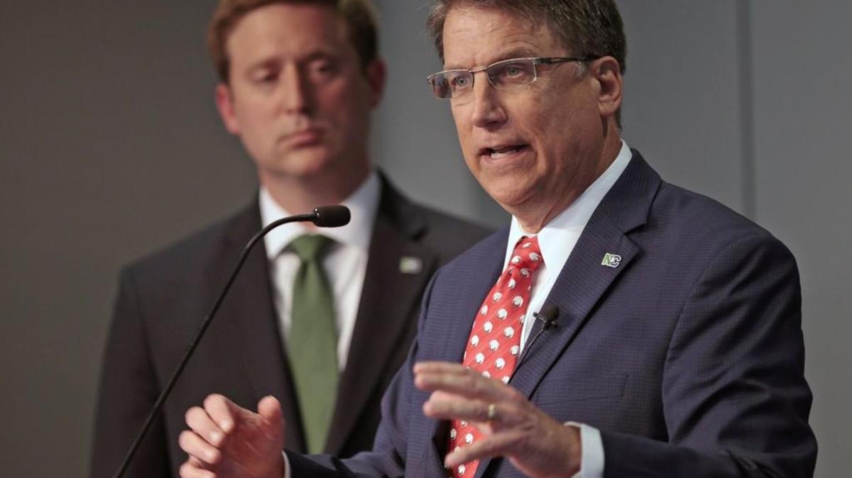 State Budget Director Andrew Heath listens as Gov. Pat McCrory gives details of the governor’s 2016-17 state budget