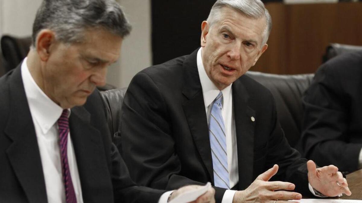 UNC Board of Governors chair John Fennebresque, left, and UNC System president Tom Ross