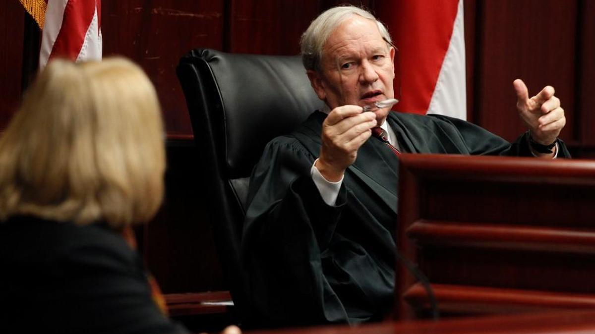 Judge Howard Manning asks a question of Dr. Tammy Howard with the Department of Public Instruction during a hearing in a special session to report on educational goals as defined in Leandro I and Leandro II Wednesday, November 13, 2013, at the Wake County Courthouse.