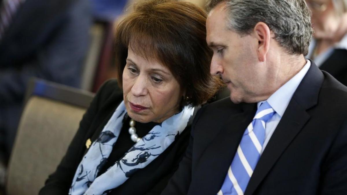 UNC-Chapel Hill Chancellor Carol Folt talks with UNC athletic director Bubba Cunningham in 2014 during a news conference, where Kenneth Wainstein presented in his report from his investigation into academic fraud at UNC-Chapel Hill Wednesday, October 22, 2014.