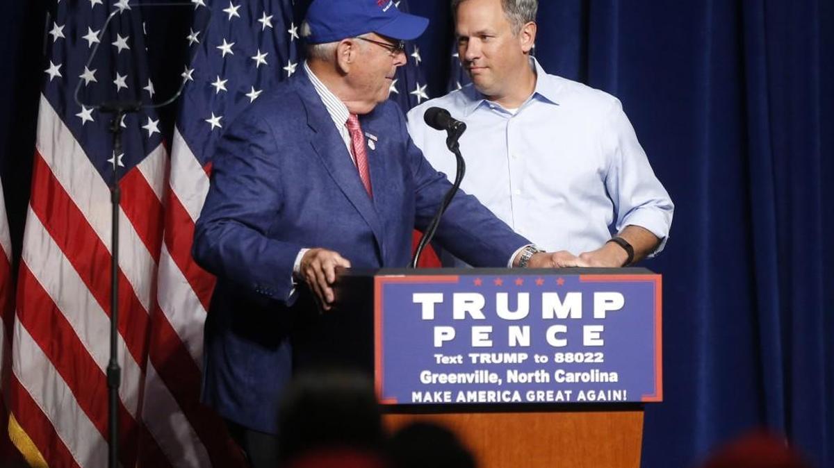 Lt. Gov. Dan Forest, right, greets NC GOP Chairman Robin Hayes during a Donald J. Trump for President Rally at the Greenville Convention Center in Greenville on Sept. 6.