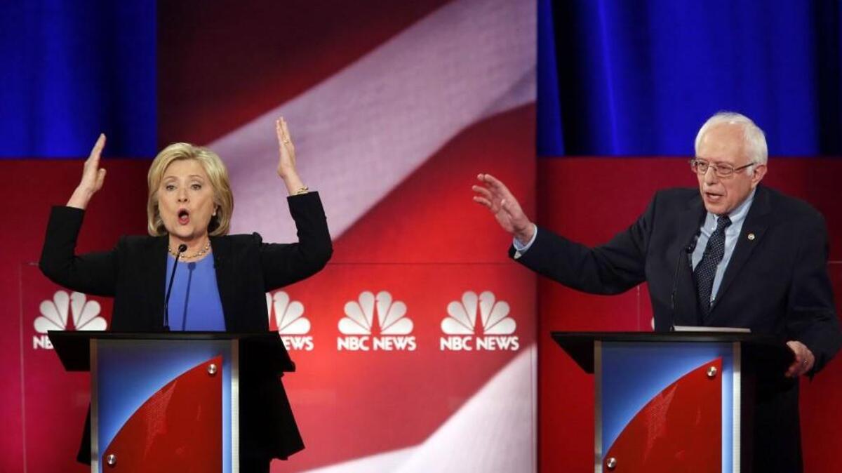 Hillary Clinton and Bernie Sanders during the Democratic presidential debate on Sunday.