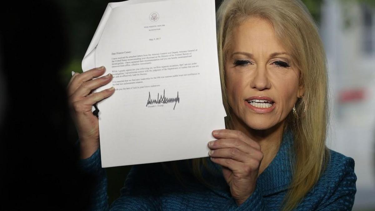 White House Counselor Kellyanne Conway holds up a copy of the firing letter that President Donald Trump had sent to FBI Director James Comey during an interview with CNN at the White House May 10, 2017 in Washington, DC. FBI Director James Comey was fired by President Donald Trump yesterday.