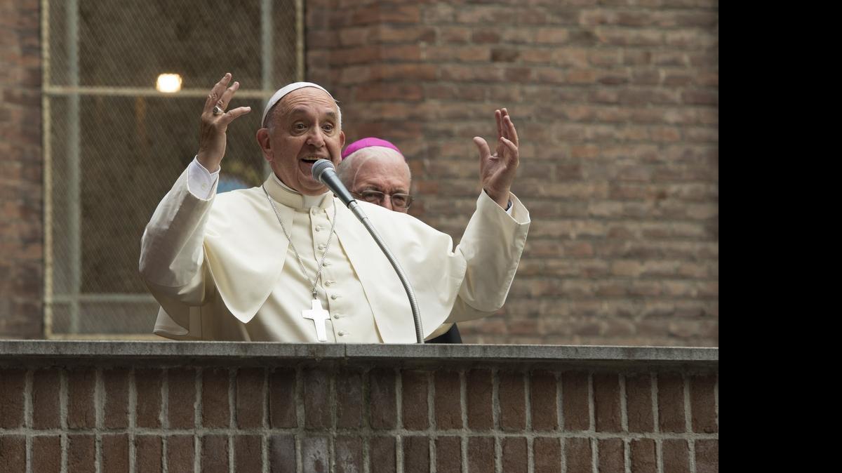
Pope Francis delivers a speech outside the Santa Maria Ausiliatrice Church in Turin, as part of his two-day visit in Turin as part of his first pastoral trip to northern Italy. 
