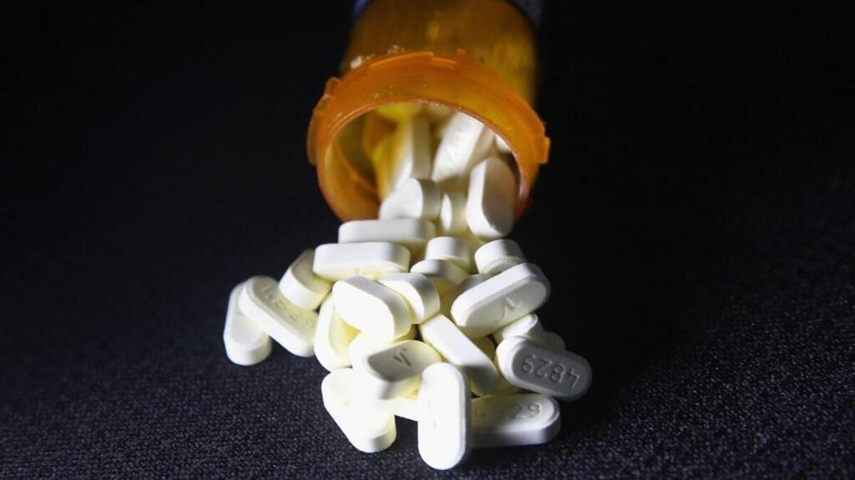 Oxycodone pain pills spill out of a prescription container on March 23, 2016 in Norwich, CT. Communities nationwide are struggling with the unprecidented opioid pain pill and heroin addiction epidemic. On March 15, the U.S. Centers for Disease Control (CDC), announced guidelines for doctors to reduce the amount of opioid painkillers prescribed, in an effort to curb the epidemic. The CDC estimates that most new heroin addicts first became hooked on prescription pain medication before graduating to heroin, which is stronger and cheaper.