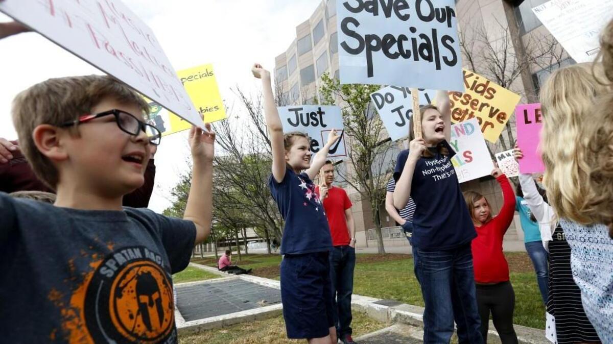 Students cheer on the speakers during a rally at Halifax Mall in Raleigh, N.C. urging the North Carolina Senate to pass House Bill 13 Wednesday, April 19, 2017. School districts around the state say arts and PE programs are at risk because they lost their flexibility to fund them when state legislators lowered class sizes for kindergarten through third grade. School officials say HB13 would allow them to save arts and PE classes.