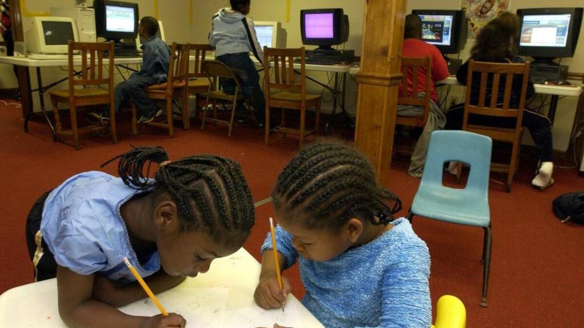 Girls write during an afterschool program in Durham.