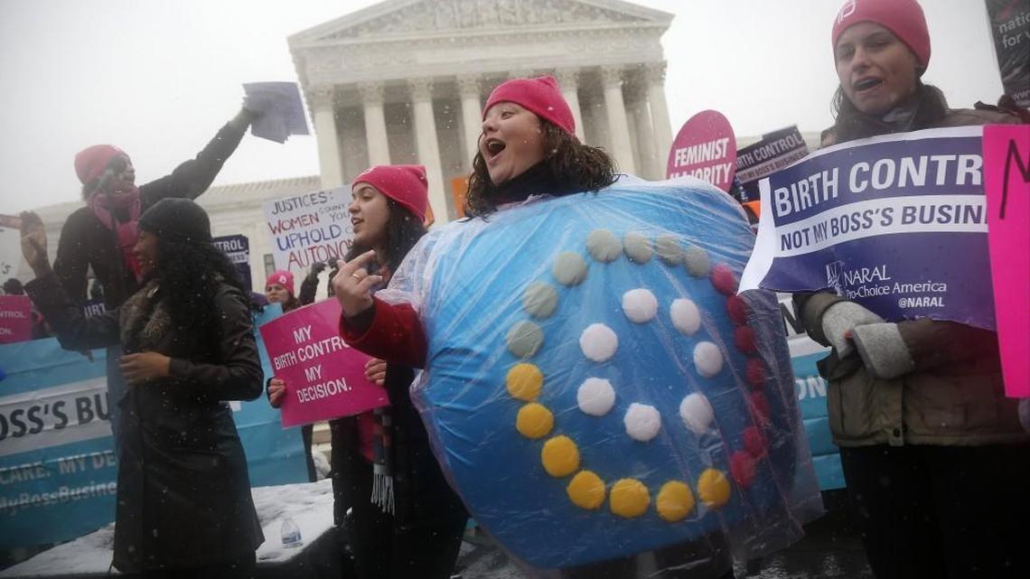 Margot Riphagen of New Orleans, La., wears a birth control pills costume as she protests in front of the Supreme Court in Washington, Tuesday, March 25, 2014, as the court heard oral arguments in the challenges of President Barack Obama's health care law requirement that businesses provide their female employees with health insurance that includes access to contraceptives.