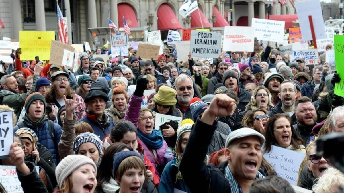 On Sunday, people gathered in Boston’s Copley Square to protest the travel ban on immigrants and refugees enacted by President Trump. On Saturday night two federal judges issued a temporary emergency order halting part of the ban.