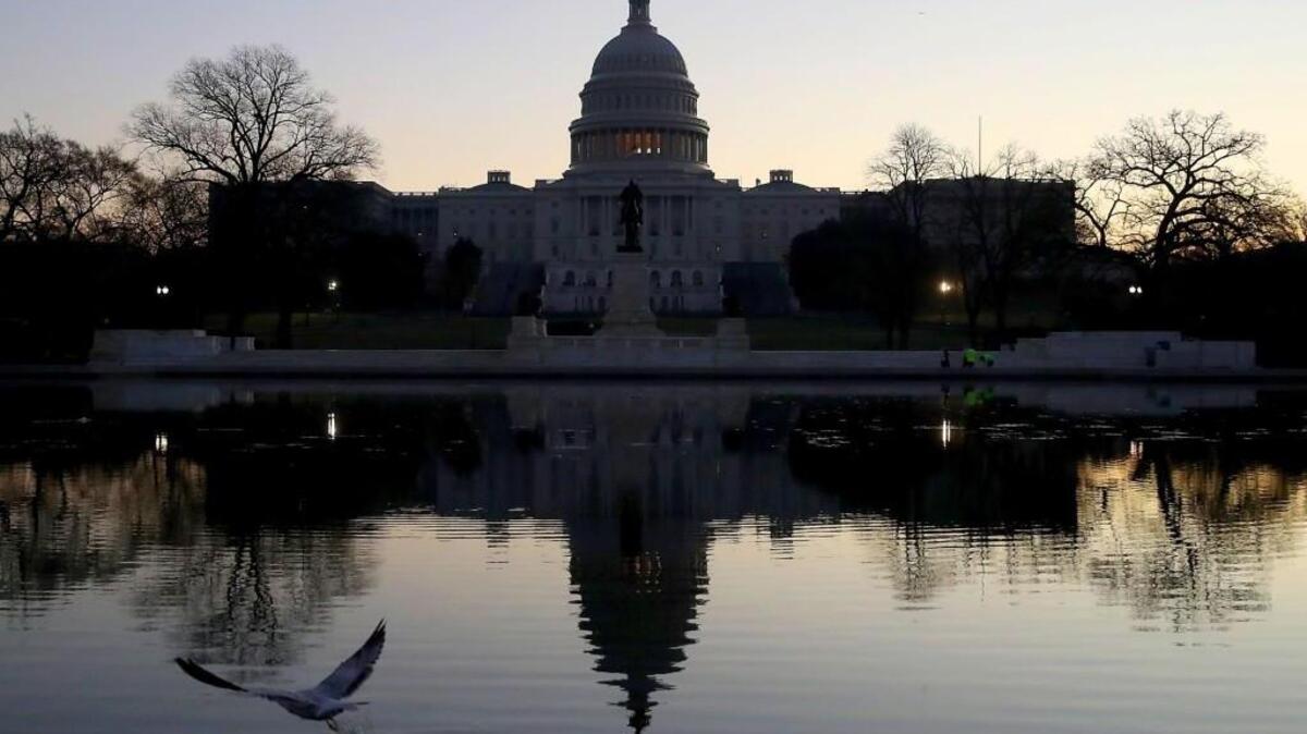 The U.S. Capitol casts early morning refections on the day that the House and Senate are scheduled to vote on President Donald Trump's Tax reform bill, on December 19, 2017 in Washington, DC.