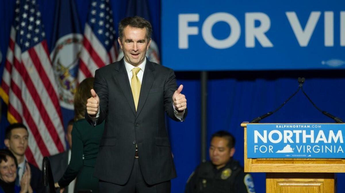 In this Tuesday, Nov. 7, 2017 file photo, Virginia Gov.-elect Ralph Northam walks onstage to celebrate his election at the Northam For Governor election night party at George Mason University in Fairfax, Va. Sweeping victories in Virginia and key gains in other 2017 state legislative races have Democrats hoping for even bigger wins in next year's midterm election.
