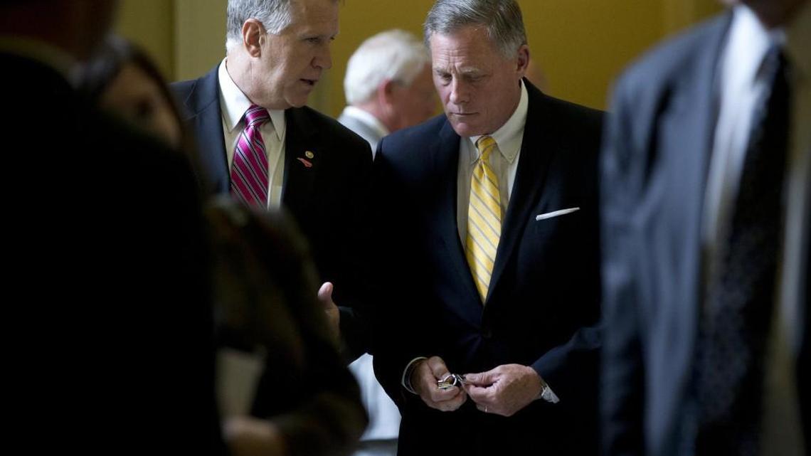 Sen. Thom Tillis, R-N.C., left, and Sen. Richard Burr, R-N.C., right, walk from a policy luncheon on Capitol Hill in Washington.