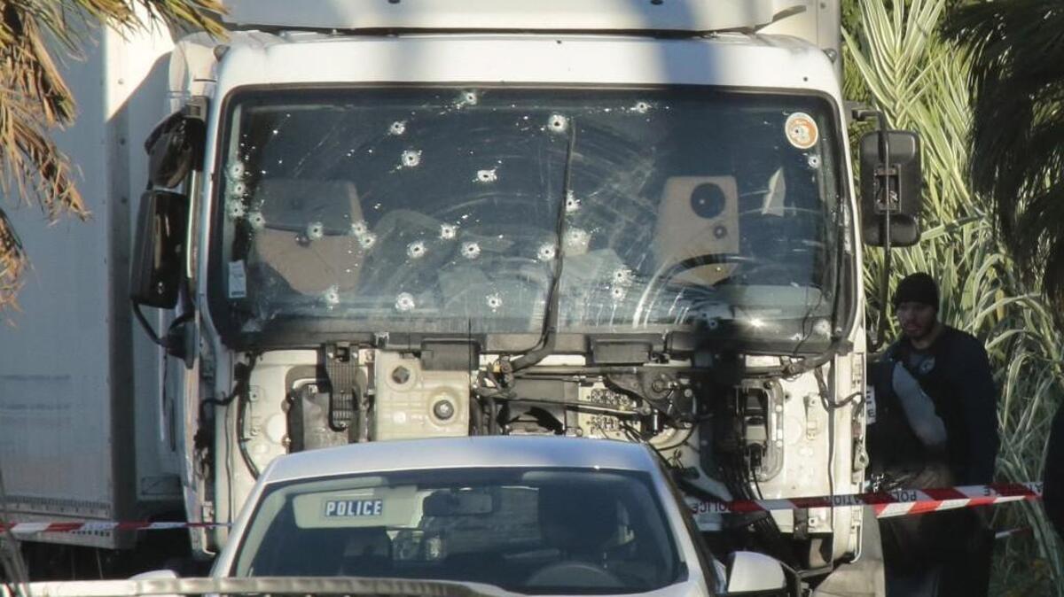 Forensic police investigate a truck at the scene of a terror attack on the Promenade des Anglais on in Nice, France.