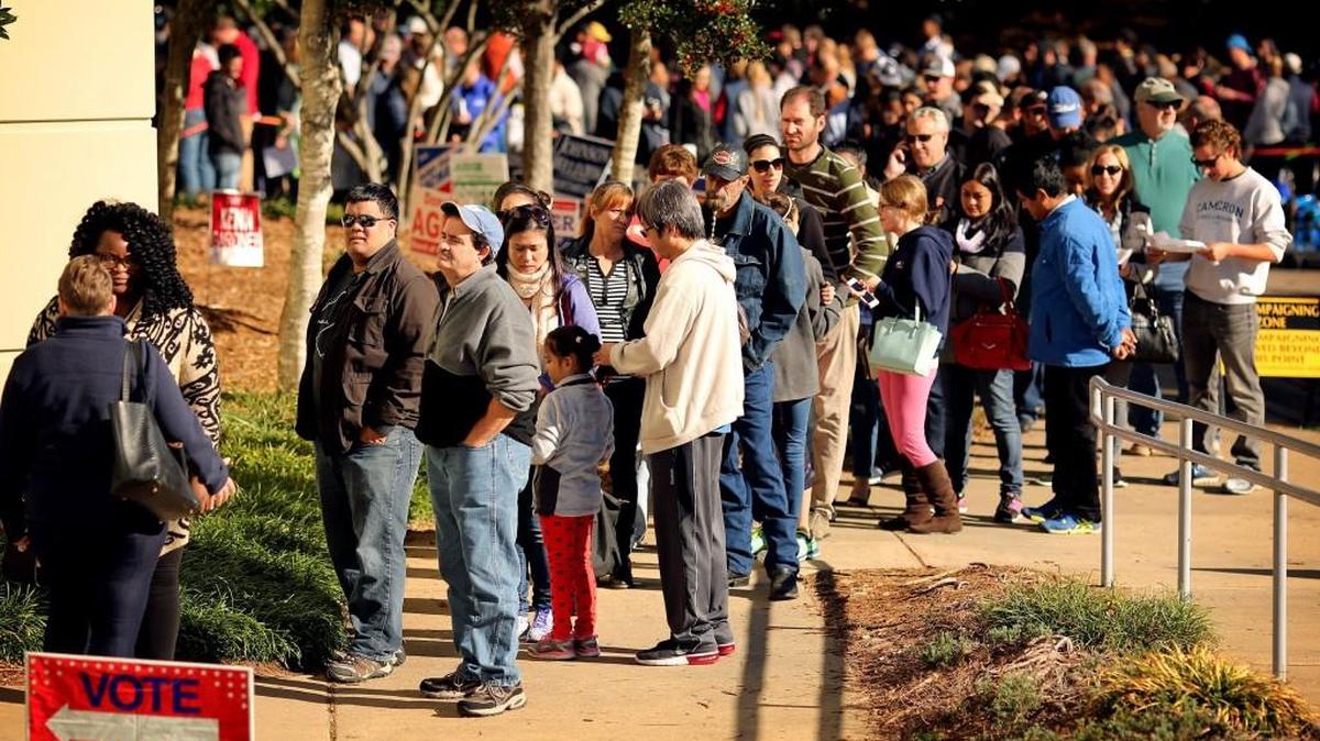 Voters wait in line for the final day of early voting at the Herbert C. Young Community Center in Cary on Nov. 5, 2016.