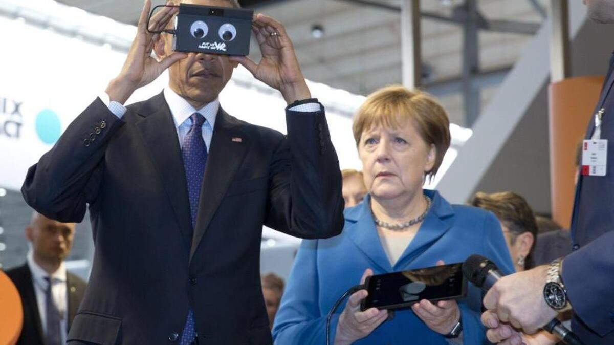 President Obama tests VR goggles at Hannover Messe with German Chancellor Angela Merkel.