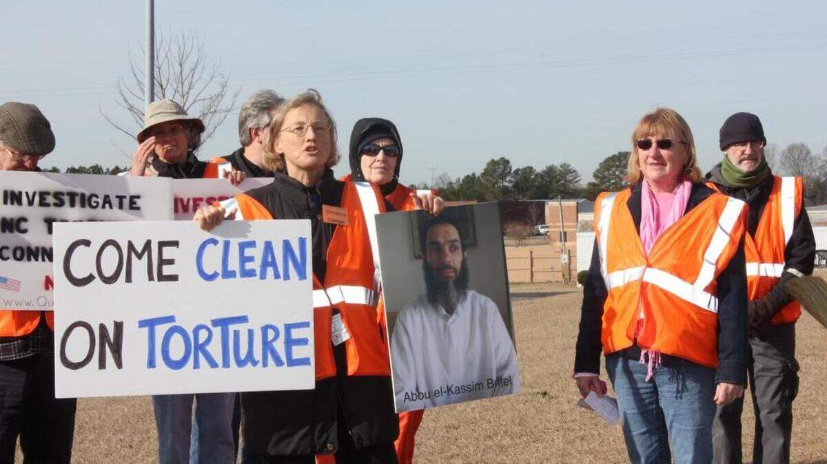 Protesters stand in front of Aero Contractors, a company based in Johnston County. They were trying to raise awareness in 2013 of rendition flights and torture of terrorism suspects.