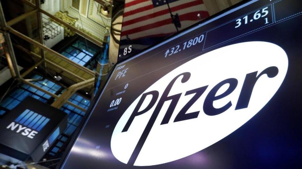 The Pfizer logo appears above a trading post on the floor of the New York Stock Exchange. Pfizer and Allergan are joining in the biggest buyout of the year, a $160 billion stock deal that will create the world’s largest drugmaker.