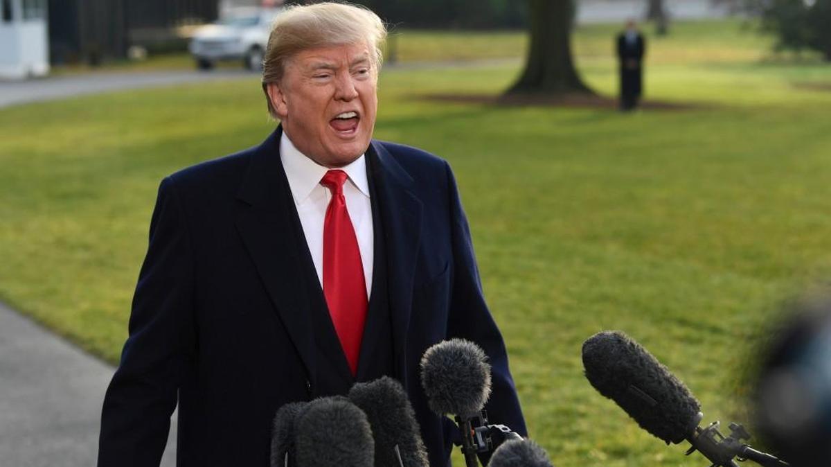 President Donald Trump speaks to reporters before boarding Marine One on the South Lawn of the White House in Washington, Monday, Dec. 4, 2017, before heading to Utah.