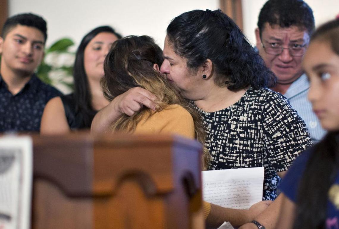 Juana Luz Tobar Ortega embraces her oldest daughter, Lesvi Molina, after Molina delivered an emotional speech on her mother’s behalf May 31 at St. Barnabas Episcopal Church in Greensboro. Ortega, who has been living in the U.S. illegally for 24 years, has been ordered to leave.