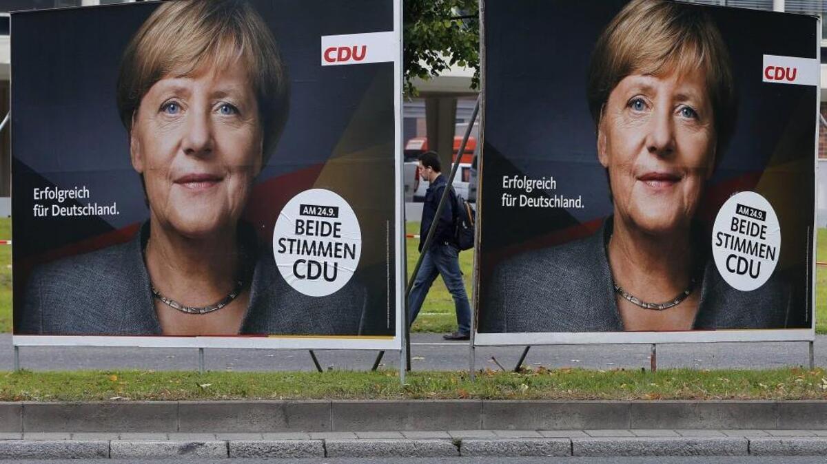 Election posters of German Chancellor Angela Merkel stand at a main street in Frankfurt, Germany, Wednesday, Sept. 20, 2017. German elections will be held on upcoming Sunday. The slogan reads “successful for Germany.”