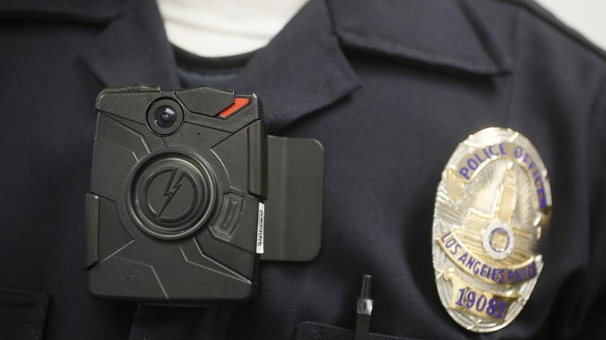 A police officer wears an on-body camera during a demonstration.