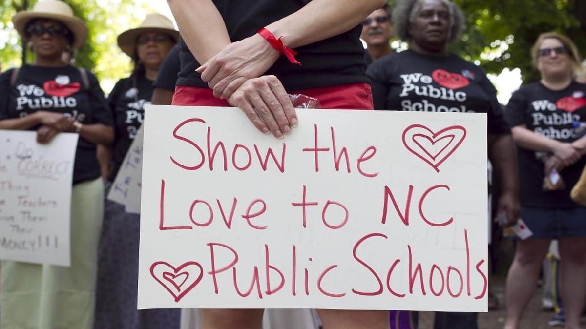 Educators and support staff from across North Carolina march to the Capitol on May 14, 2014, calling on legislators to provide more funding for teacher pay.